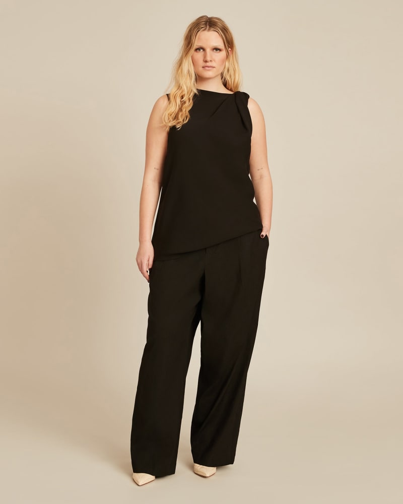 Front of a model wearing a size 2X Pleat Front Pull On Pant in BLACK by Vince. | dia_product_style_image_id:225886